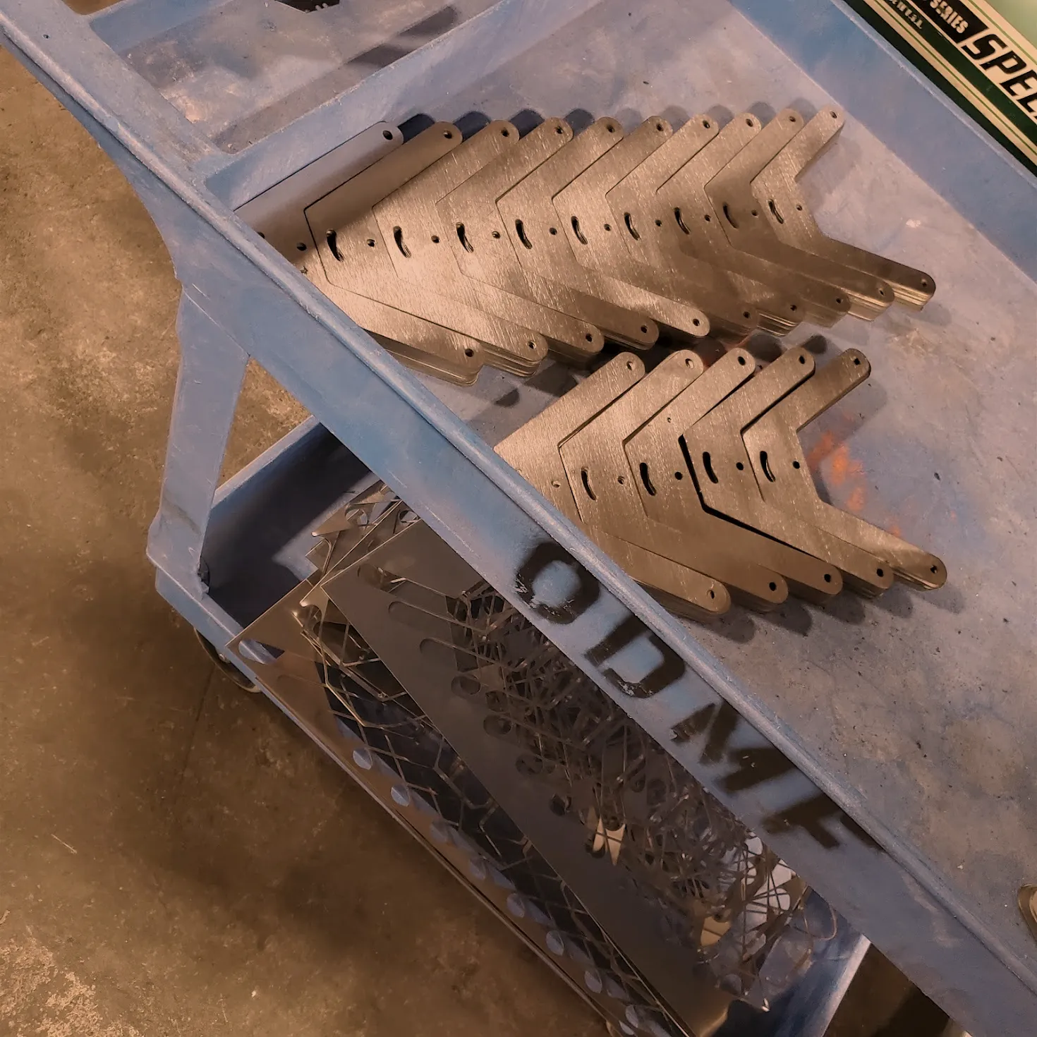 Production run of laser cut brackets on an ODMF cart, prototyping and production assembly at O'Donnell Metal Fab