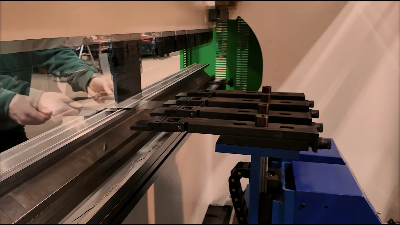 Operator bending sheet metal on the press brake at O'Donnell Metal Fab, metal forming in Norristown PA