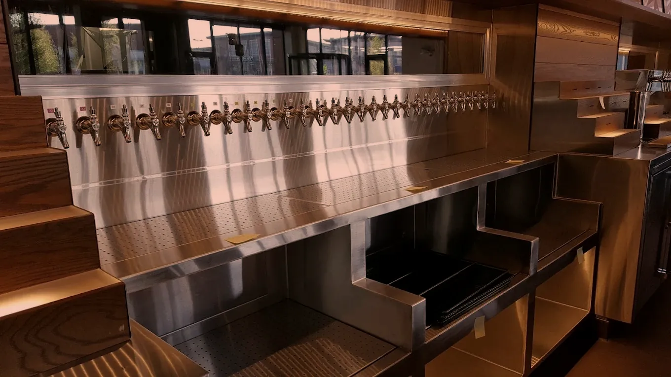 Stainless steel tap wall and bar back counter with drip trays fabricated by O'Donnell Metal Fab in Norristown PA