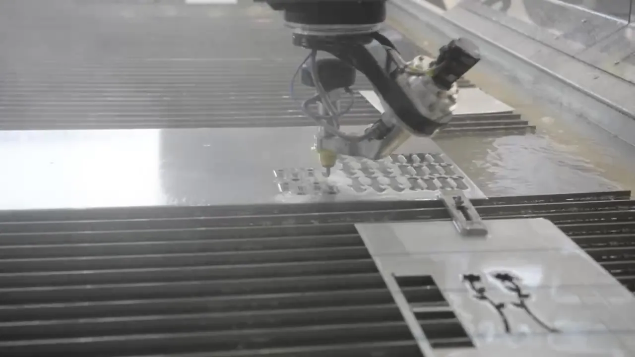 Waterjet cutting head over a sheet of metal at O'Donnell Metal Fab in Norristown PA