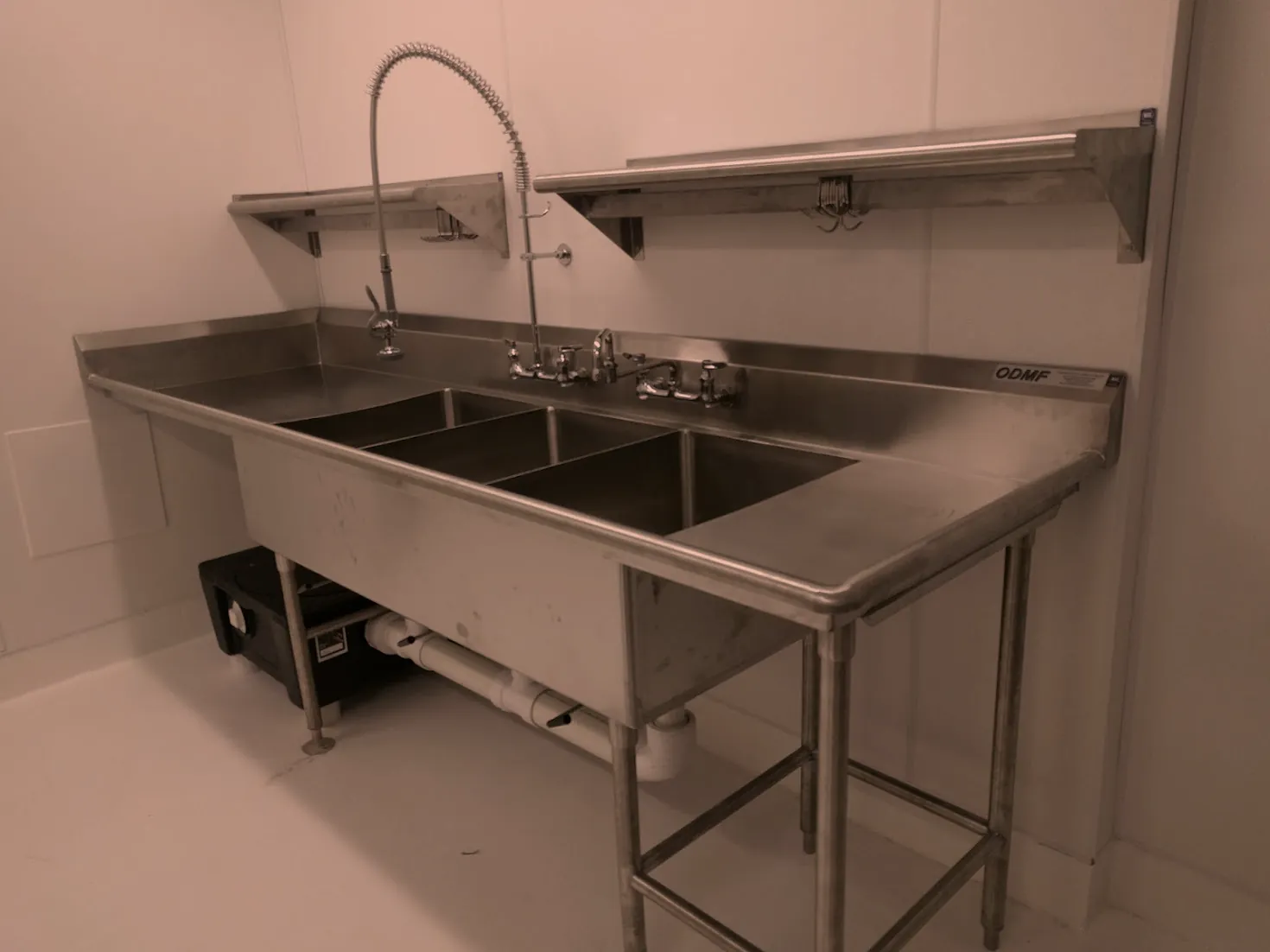 Custom stainless steel three compartment sink with drainboards and overshelf, fabricated by O'Donnell Metal Fab