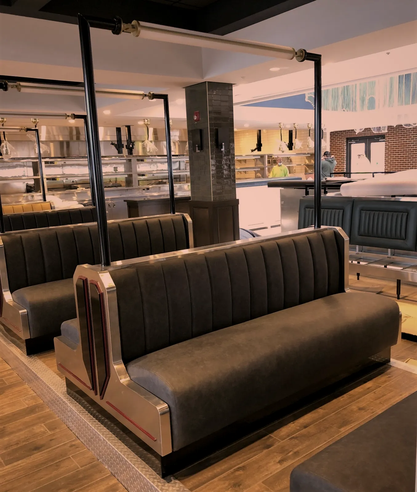 Restaurant booth seating with custom stainless steel frames and trim fabricated by O'Donnell Metal Fab