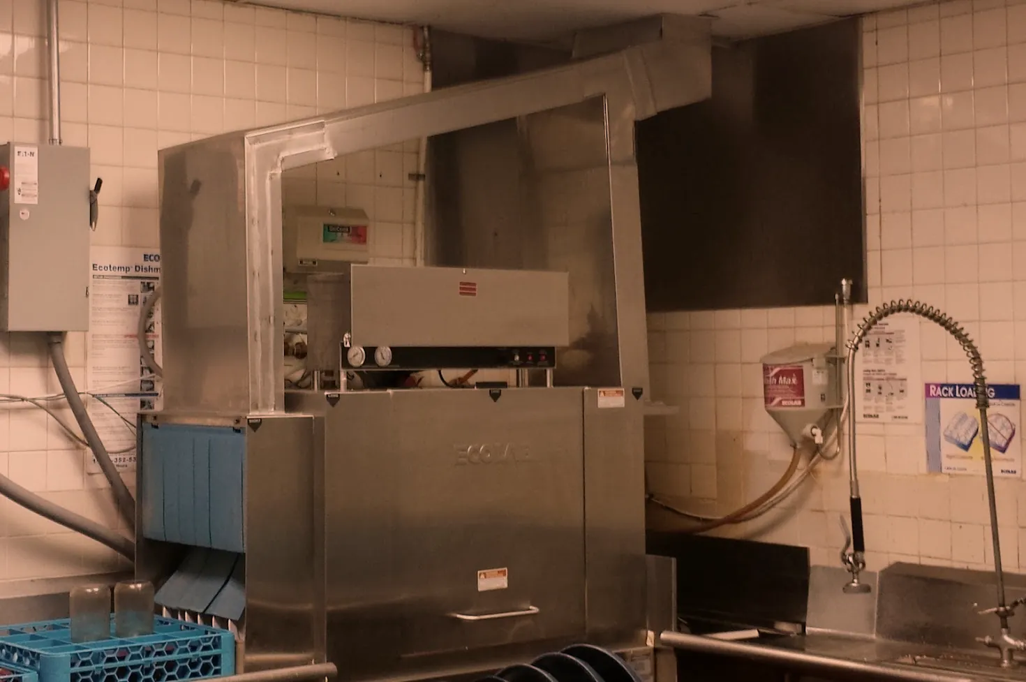 Stainless steel hood enclosure installed over a conveyor dish machine, custom equipment housing by O'Donnell Metal Fab Norristown PA