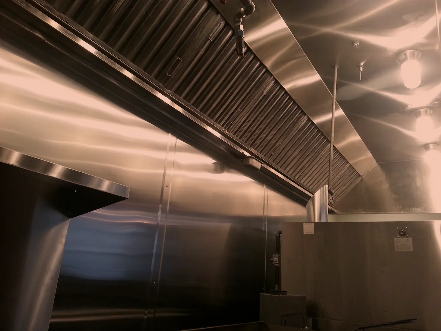 Interior of a fabricated stainless steel hood enclosure with filter banks, metal enclosure fabrication in Norristown PA