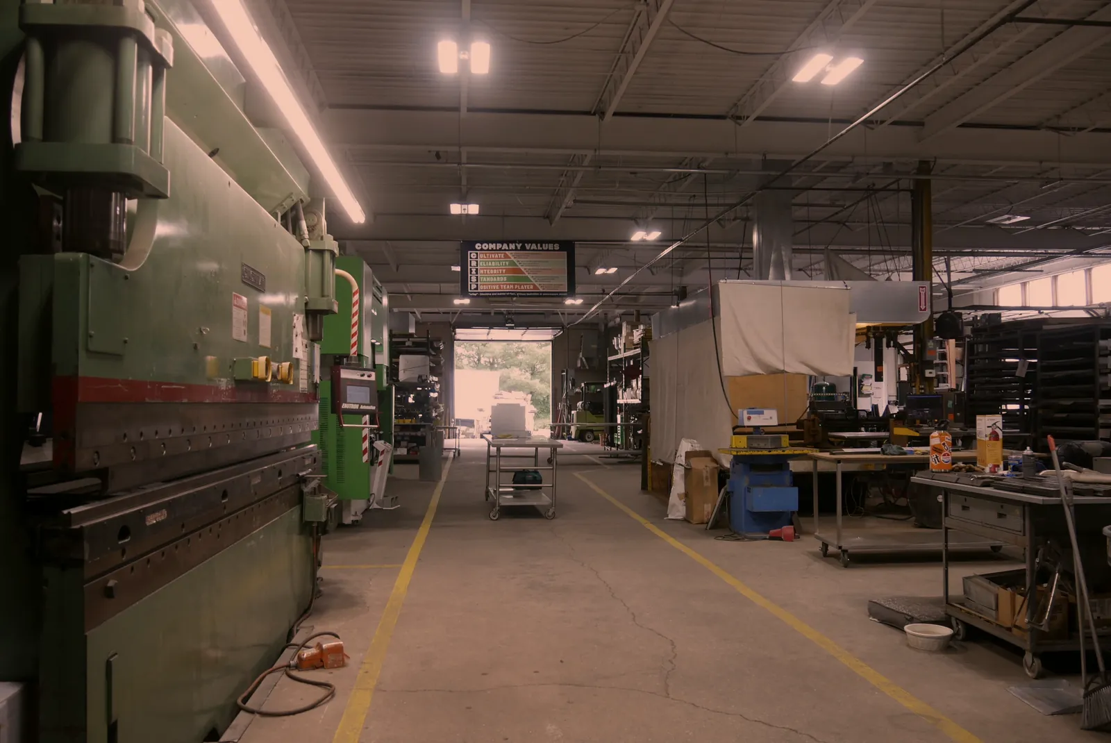 Sheet metal fabrication shop floor at O'Donnell Metal Fab in Norristown PA with the press brake line and work tables